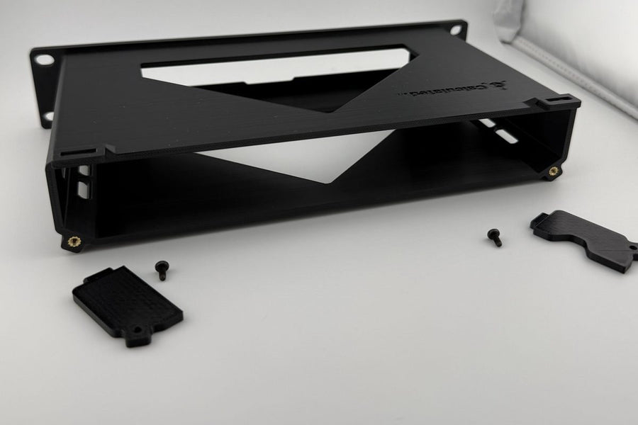 A mount with its hardware and clip laid out before assembly
